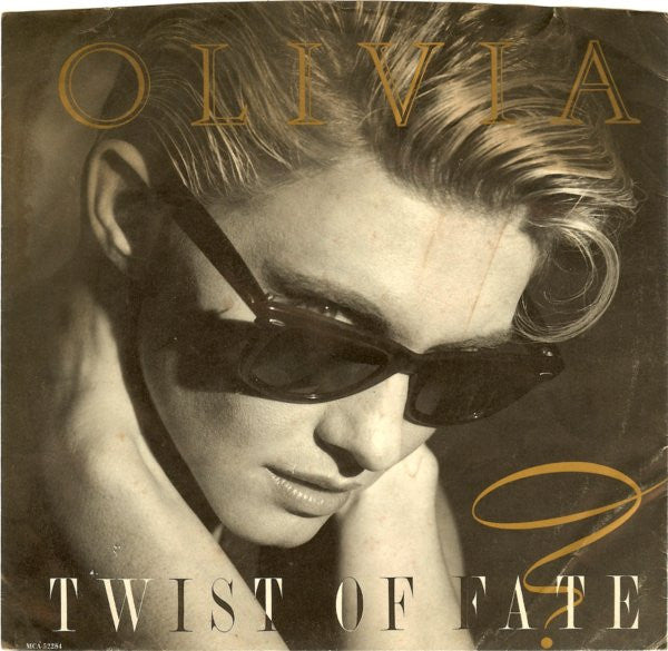 Olivia* : Twist Of Fate (7", Single, Glo)